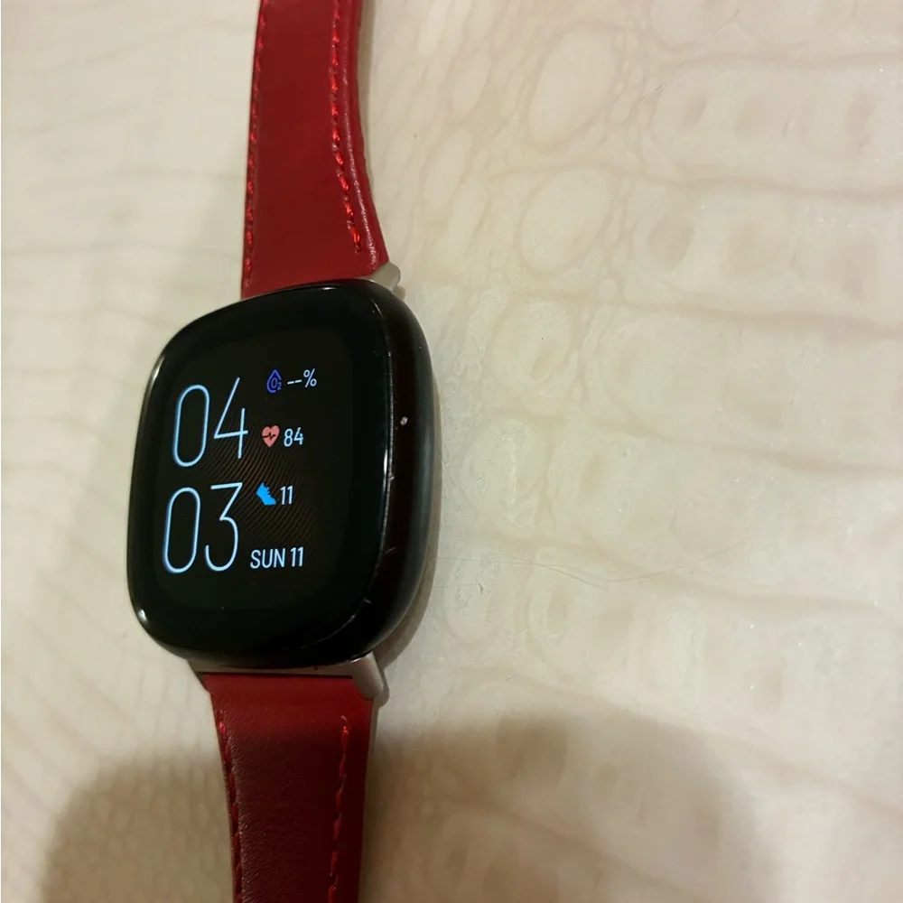 Fitbit Smartwatch with Red Strap